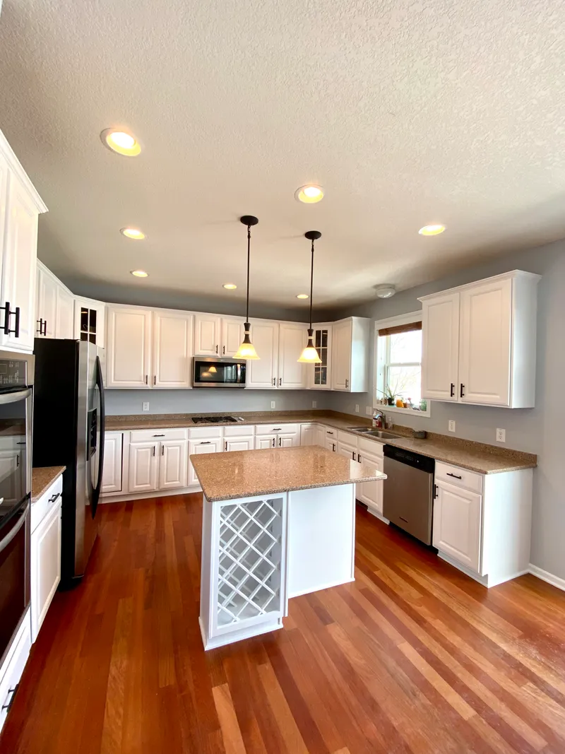 The same kitchen with cabinets painted white